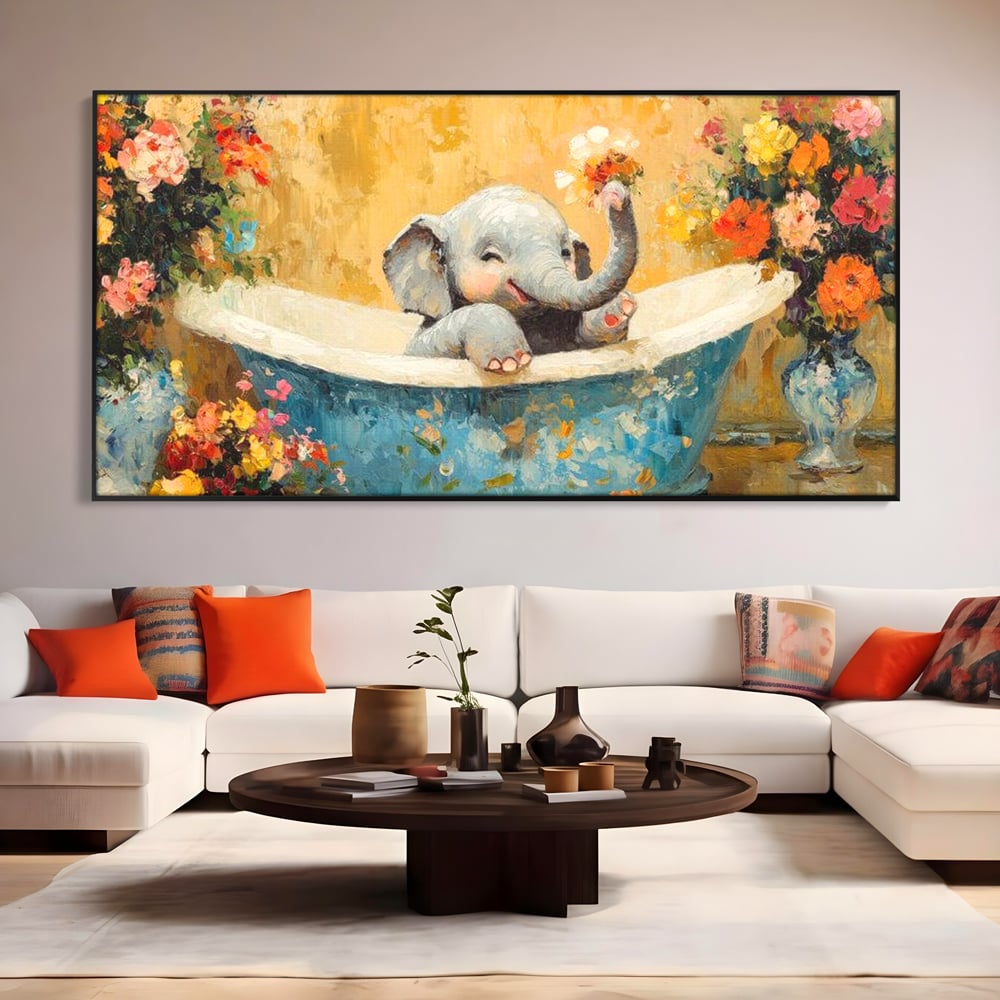 Tablou canvas cu tablou canvas cu pui de elefant in cada, in rama de aluminiu negru, pe perete intr-un living